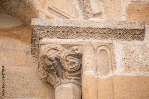 detail of a stone capital and part of the arch of a Romanesque church. Santa María de la oliva, Villaviciosa, Romanesque and pre-Romanesque of Asturias.