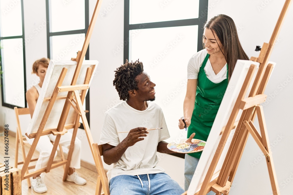 Fototapeta premium Group of people smiling happy drawing at art studio.