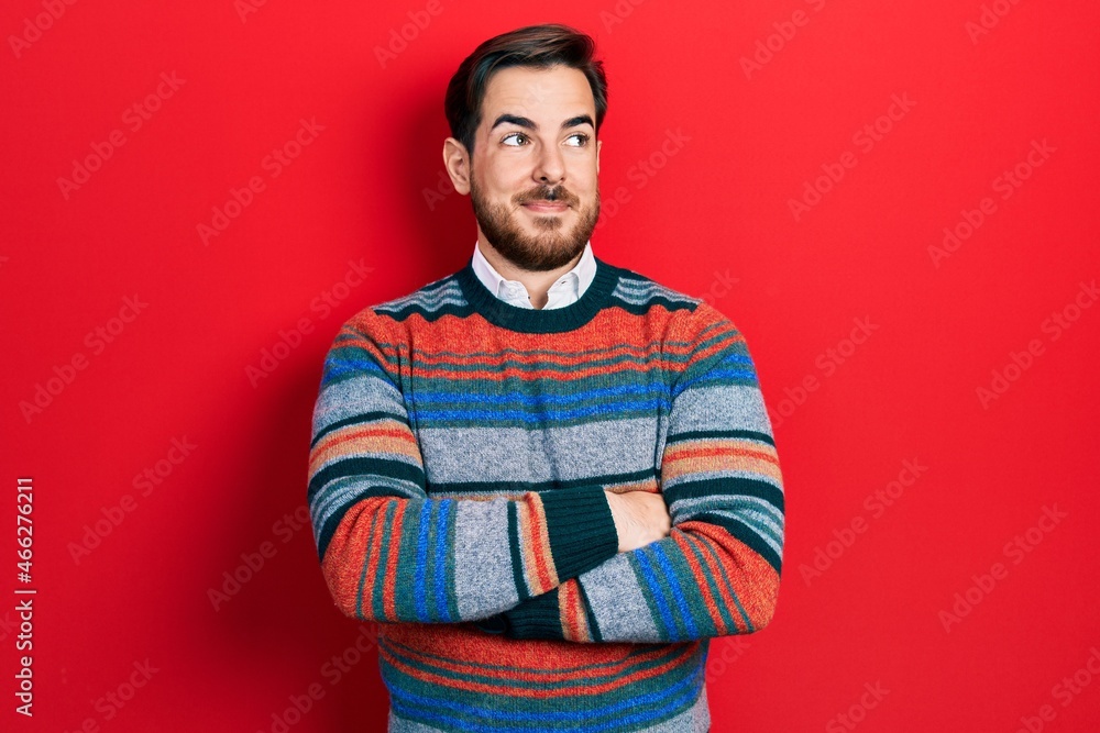 Handsome caucasian man with beard with arms crossed gesture smiling looking to the side and staring away thinking. Handsome caucasian man with beard with arms crossed gesture smiling looking to the side and staring away thinking.