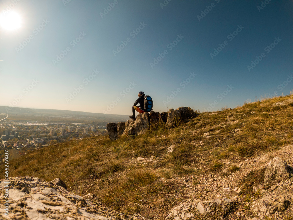 Adventure man with back pack in mountain top. Budapest, Hungary