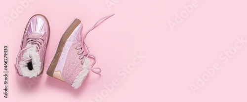 Fashionable shoes for a girl on a pink background. Top view, flat lay. Banner.