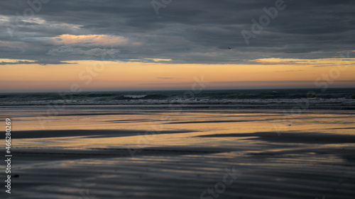 Sunset ocean reflection at Hawke Bay in New Zealand