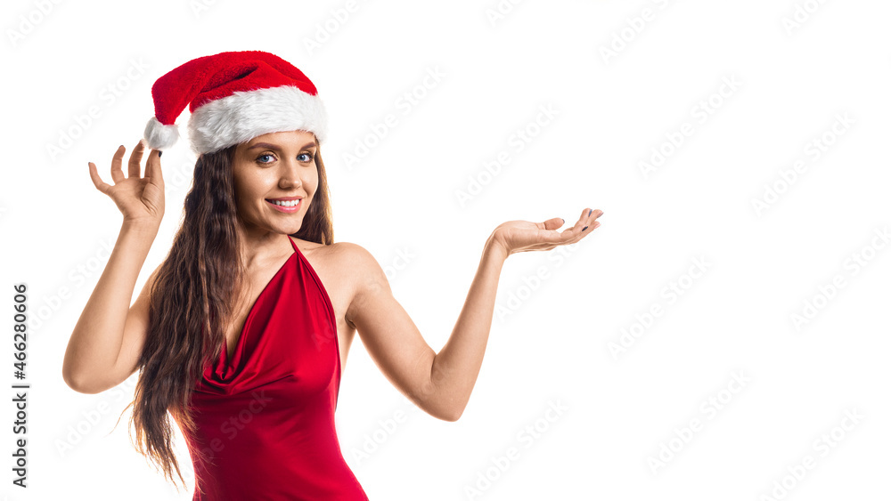 Stylish woman in red dress and Santa hat showing on your product isolated on white background. Format photo 16x9. Stylish woman in red dress and Santa hat showing on your product isolated on white background. Format photo 16x9.