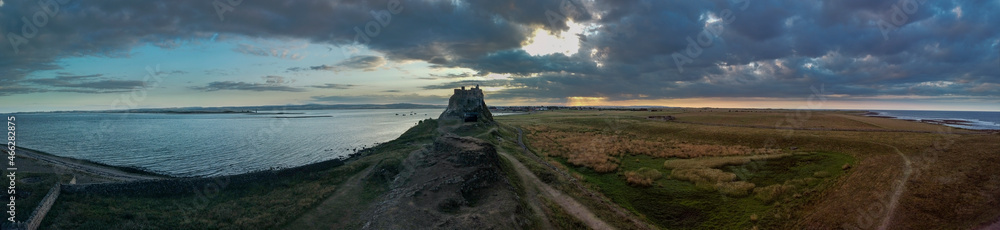 Summer evening view of Lindisfarne Castle on Holy Island, Northumberland Summer evening view of Lindisfarne Castle on Holy Island, Northumberland