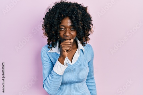 Young african american woman wearing casual clothes feeling unwell and coughing as symptom for cold or bronchitis. health care concept.