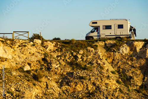 Camper camping on cliff rock, Spain