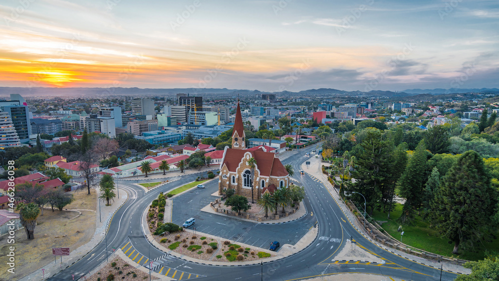 Aerial view of historical landmark Christ Church aka Christuskirche at sunset in Windhoek, the capital and largest city of Namibia.