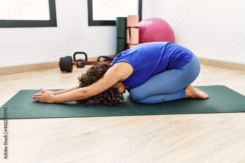 Young middle east woman stretching at sport center