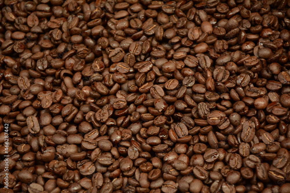 Roasted coffee beans background. Coffee beans in front of spice shop in the Turkish bazaar in Akko (Acre) in Israel Roasted coffee beans background. Coffee beans in front of spice shop in the Turkish bazaar in Akko (Acre) in Israel