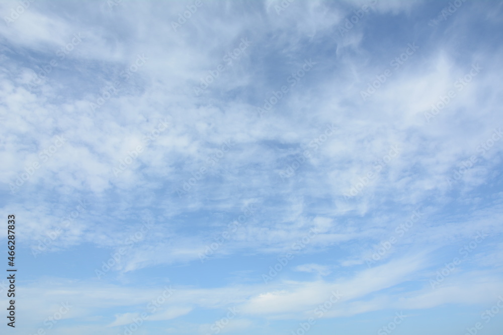 Unusual cirrus clouds in the blue sky. Beautiful sky background.