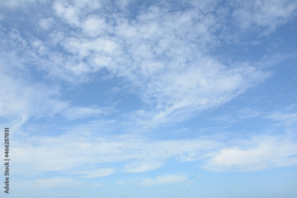 Unusual cirrus clouds in the blue sky. Beautiful sky background.