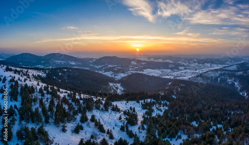 Picturesque winter panorama of snowy mountain hills