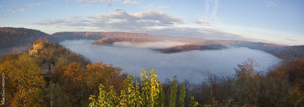 Panorama of an autumn sunrise  with fog in the valley over the ruins of Nový Hrádek Castle and Dyje river in the Podyjí National Park