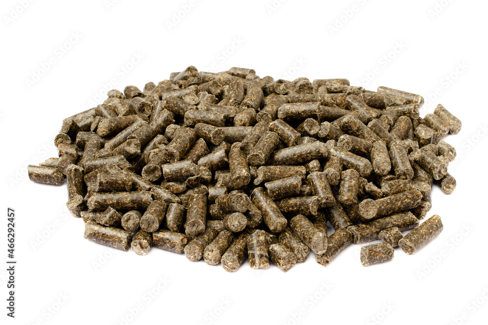 Sunflower granulated feed isolated on white background, closeup. Pile