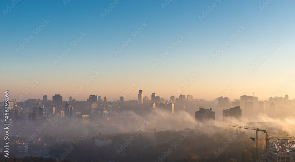Kyiv skyline in foggy morning