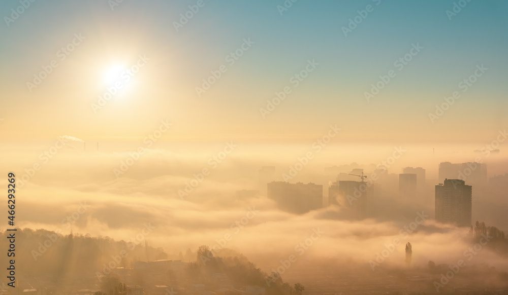 Waves of fog over city at sunrise Waves of fog over city at sunrise