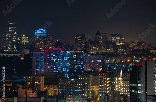 City skyline in twilight, illuminated skyscrapers in downtown