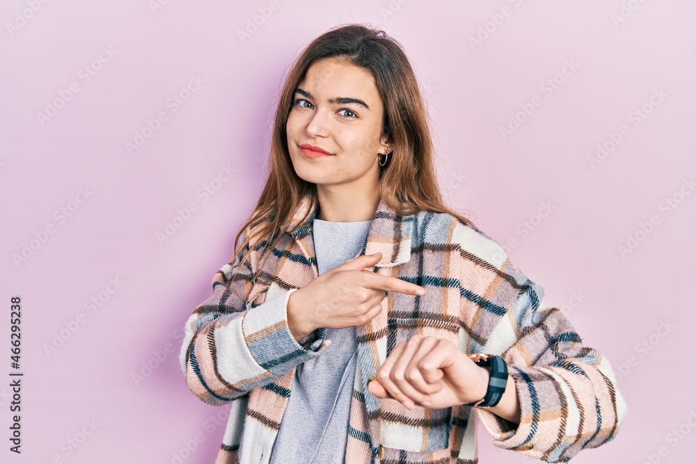 Young caucasian girl wearing casual clothes in hurry pointing to watch time, impatience, upset and angry for deadline delay Young caucasian girl wearing casual clothes in hurry pointing to watch time, impatience, upset and angry for deadline delay