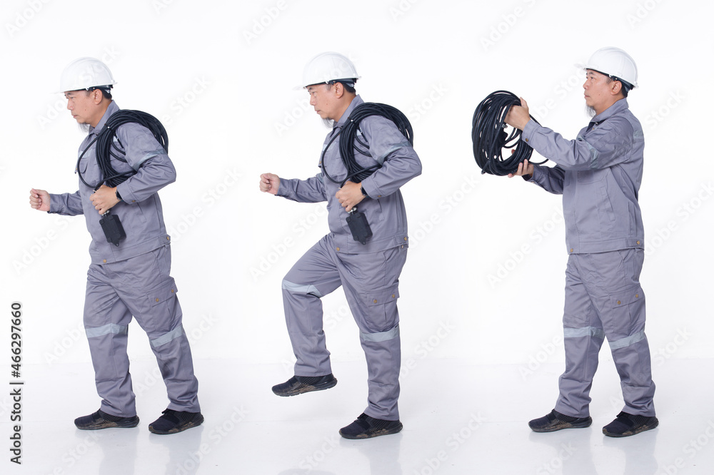 Full length portrait 50s 60s Asian elderly Man in Gray uniform hardhat as electric engineer, isolated Full length portrait 50s 60s Asian elderly Man in Gray uniform hardhat as electric engineer, isolated