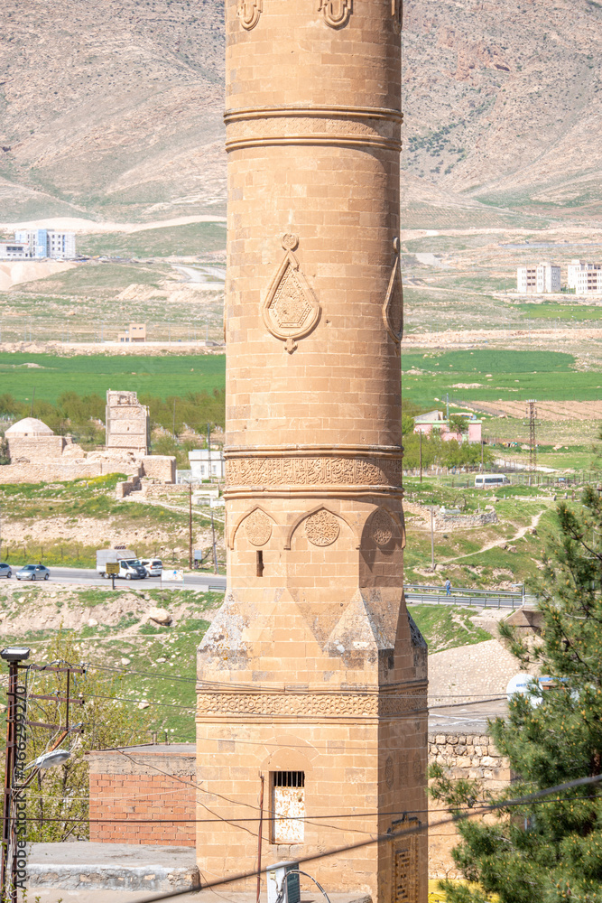 Part of a large Muslim mosque minaret of Ottoman architecture built with red sandstone and bas-reliefs