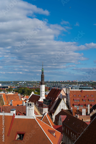 Aerial view of the old town of Tallinn. Red tiled roofs of the old medieval houses on a sunny autumn day. Tallinn city centre on a background.