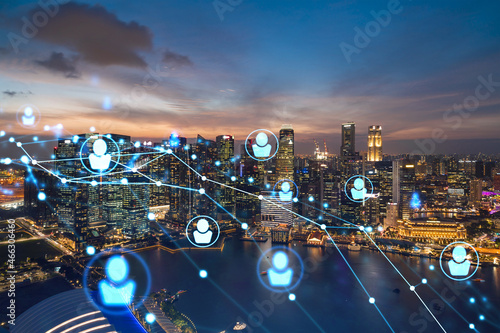 Photography Glowing Social media icons on night panoramic city view of Singapore, Asia
