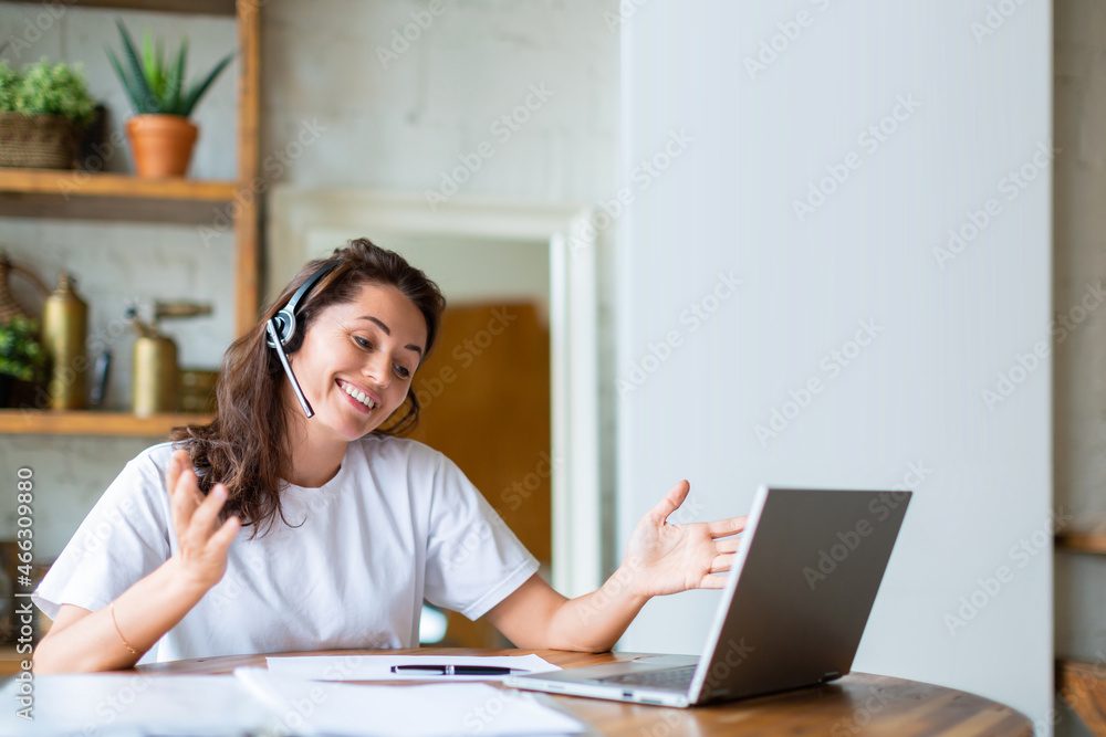 Middle ageda 40 years old woman during online video call. Working from home concept.