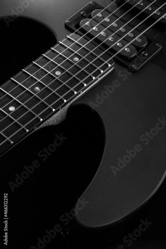 Electric guitar close up. Black and white picture.