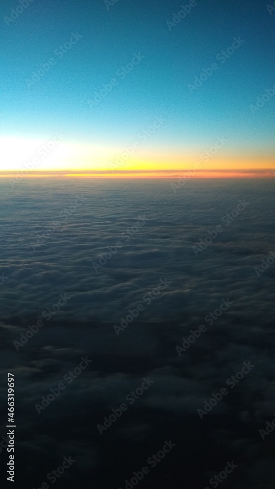 view of the dawn from the window of the aircraft