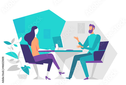 Due persone, uomo e donna, sedute in ufficio parlano al tavolo durante un'incontro di lavoro photo