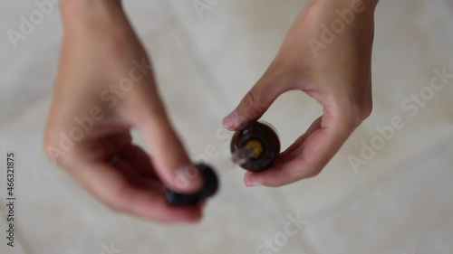 Wallpaper Mural Unrecognizable woman applies transparent moisturizing rejuvenating serum with hyaluronic acid to hands. Gel in glass bottle made of dark glass. Home care concept, beauty treatments, natural cosmetics Torontodigital.ca