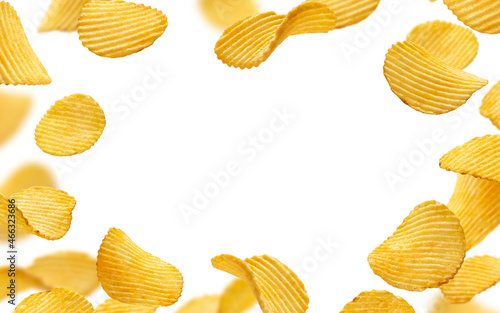 Frame of ridged potato chips isolated on white background