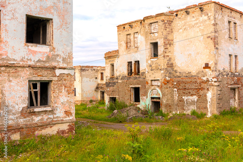 Ruins of low-rise brick houses in the empty city of Vorgashor Russia. 
