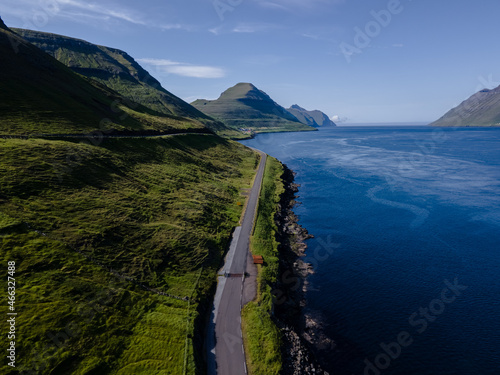 Beautiful aerial view of Sydradalur port and village near the Seal woman statue in the Faroe Islands photo