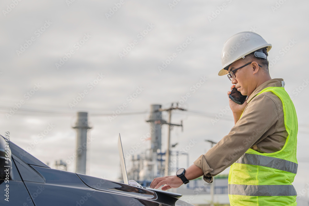 Asian man petrochemical engineer working at oil and gas refinery plant industry factory,The people worker man engineer work control at power plant energy industry manufacturing Asian man petrochemical engineer working at oil and gas refinery plant industry factory,The people worker man engineer work control at power plant energy industry manufacturing
