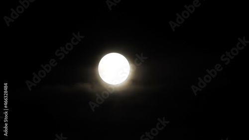 luna de octubre color blanco bajo el firmamente oscuro de una noche de otoño en el pueblo de teillor, mellid, españa, europa photo