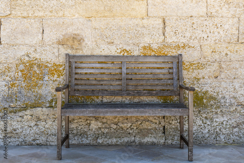 an old bench in an old stone town