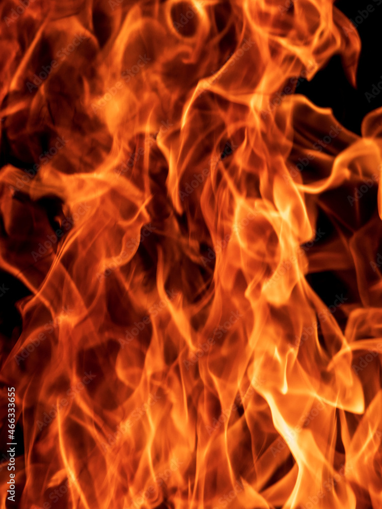 Abstract flame, fire flame texture, background. Blurred moving tongues of fire on a dark background. Abstract flame, fire flame texture, background. Blurred moving tongues of fire on a dark background.
