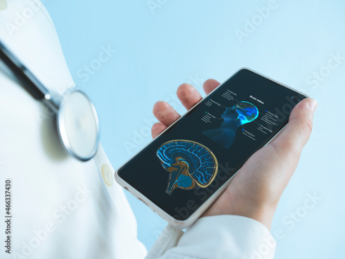Medicine doctor with stethoscope using mobile smart phone, reading anatomy , doctor room. Medical student browsing internet on smartphone, close up. 3d render