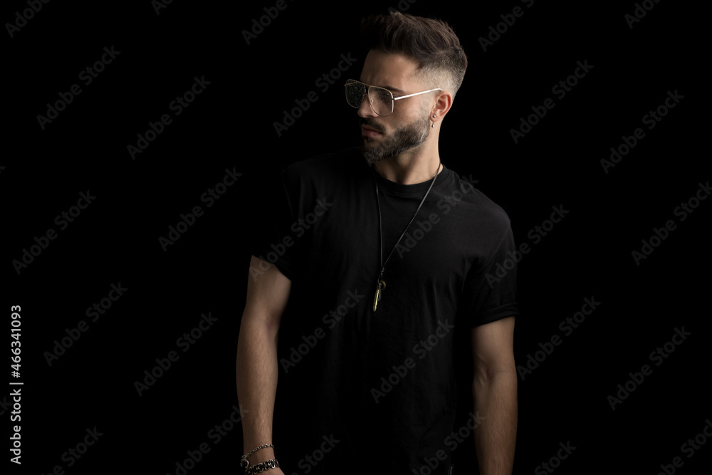 dramatic cool guy with glasses looking to side dramatic cool guy with glasses looking to side