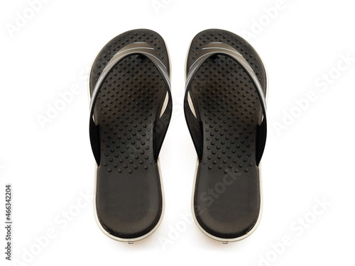 Aerial view of black rubber flip flops isolated on white background. Close up of high quality toe beach slippers. Fashion accessories and shoe store.