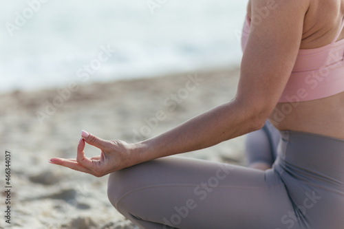 woman doing yoga on beach, meditation near the sea