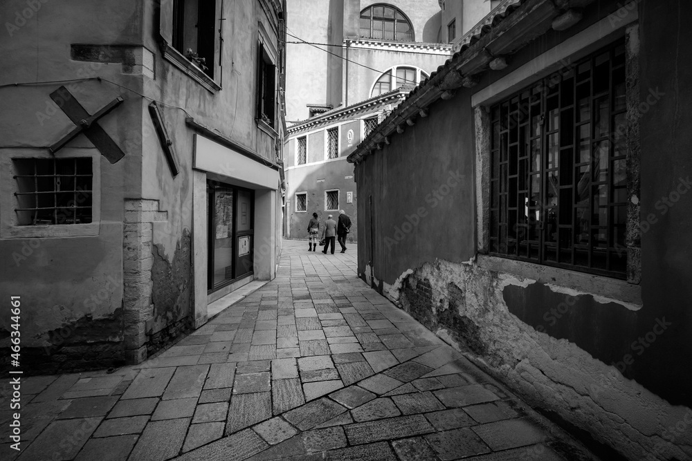 Black and white. Early morning walks through the streets of the old city of Venice. Venice without water. Squares and streets of the old town. Italy. Veneto.