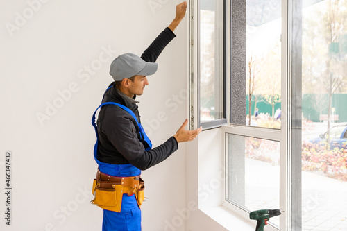 Canvas Print Construction Worker Installing New Windows In House