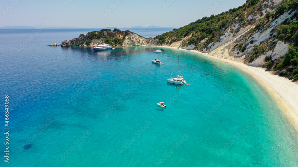 Aerial panoramic wide photo of paradise turquoise Gidaki beach and moored luxury boats in Ithaca Greece