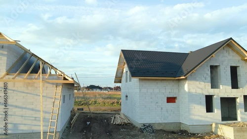 Wallpaper Mural Aerial view of unfinished frame of private house with aerated lightweight concrete walls and wooden roof frame under construction Torontodigital.ca