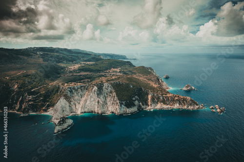 Aerial photo of paradise exotic sea of Myrtos beach under mountain and huge cloud at Kefalonia island Greece
