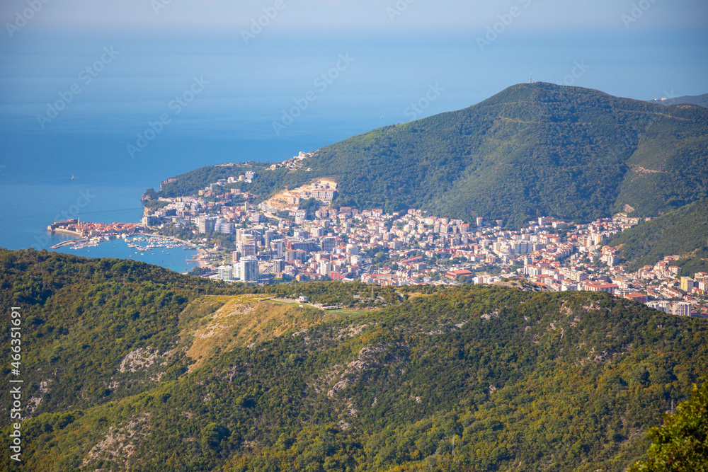 Aerial view of Budva Town in Montenegro . Panorama of Adriatic Coast and green mountains