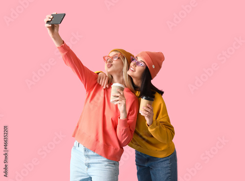 Cool young women taking sel...