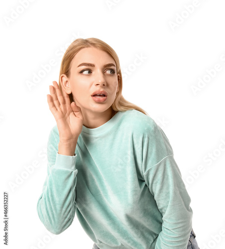 Young woman trying to hear ...